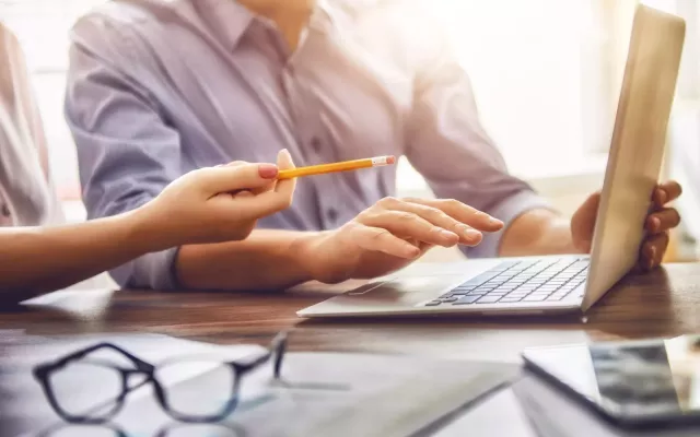 man typing on computer