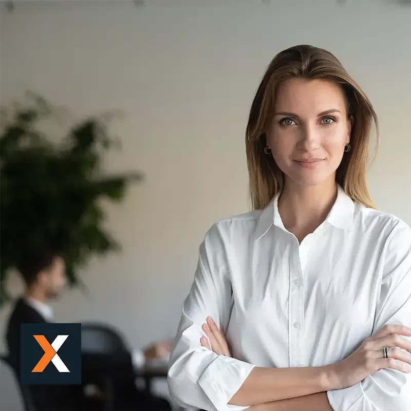 business women standing looking at camera with arms crossed