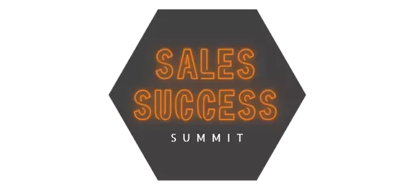 An orange, neon sign that says "Sales Success Summit" on a gray hexagon