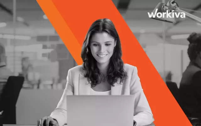 black and white woman working off a laptop facing the camera blog header for Xactly