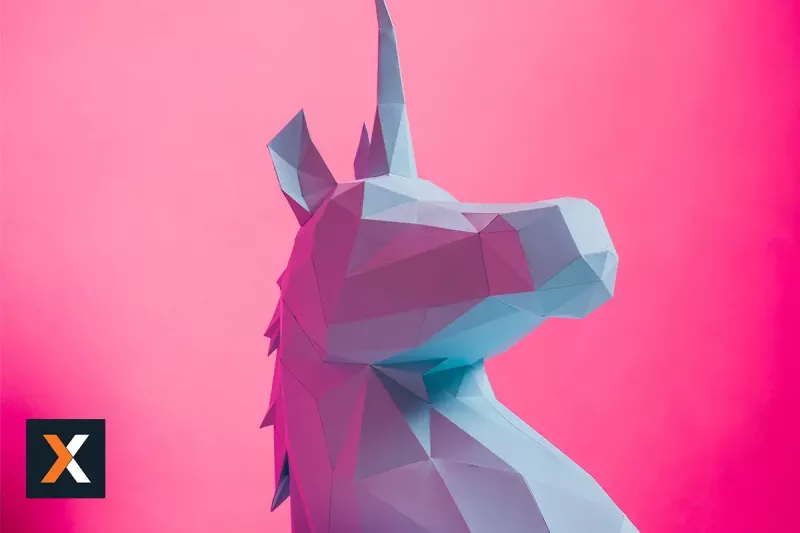 sculpted blue unicorn on bright pink background